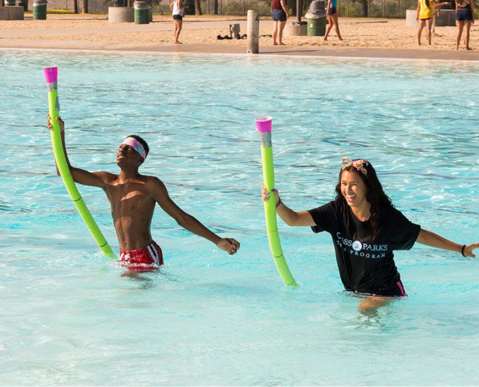 children playing a game in a pool